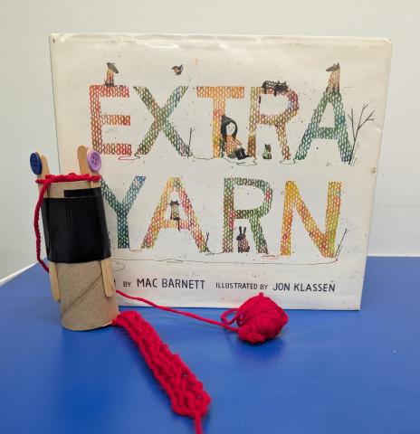 Knitting spool and Book titled Extra Yarn