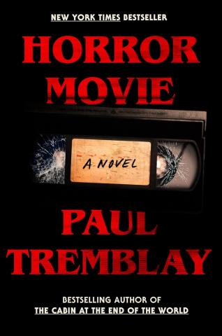 the title "Horror Movie" on the top, and the name Paul Tremblay on the bottom, both written in a stereotypical thick red 80s font. In the center is a picture of a damaged VHS tape
