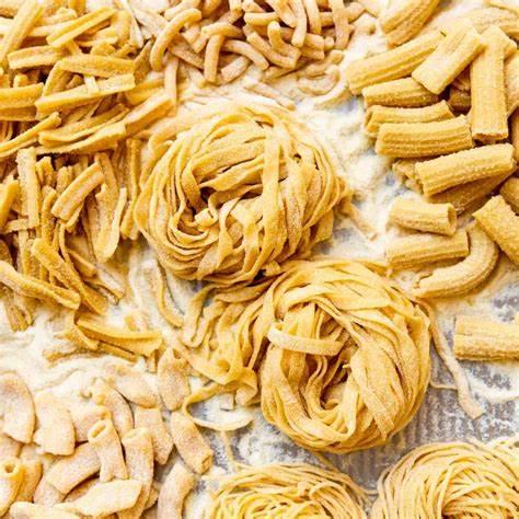 Different types of homemade pastas on a table